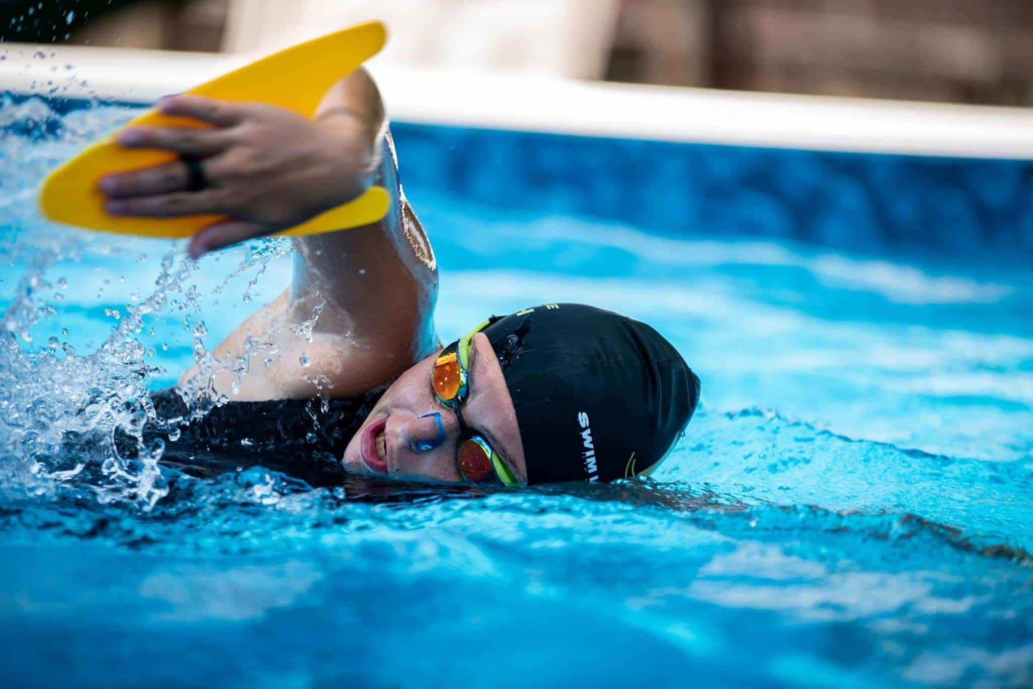Swimmer inhaling while breathing during swimming.
