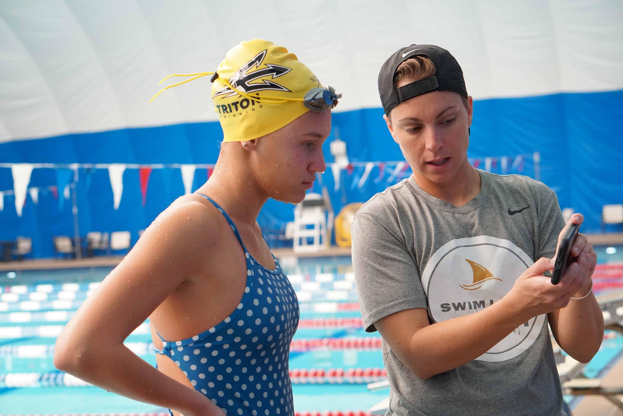 Abbie Fish doing an in-person training with a swimmer.