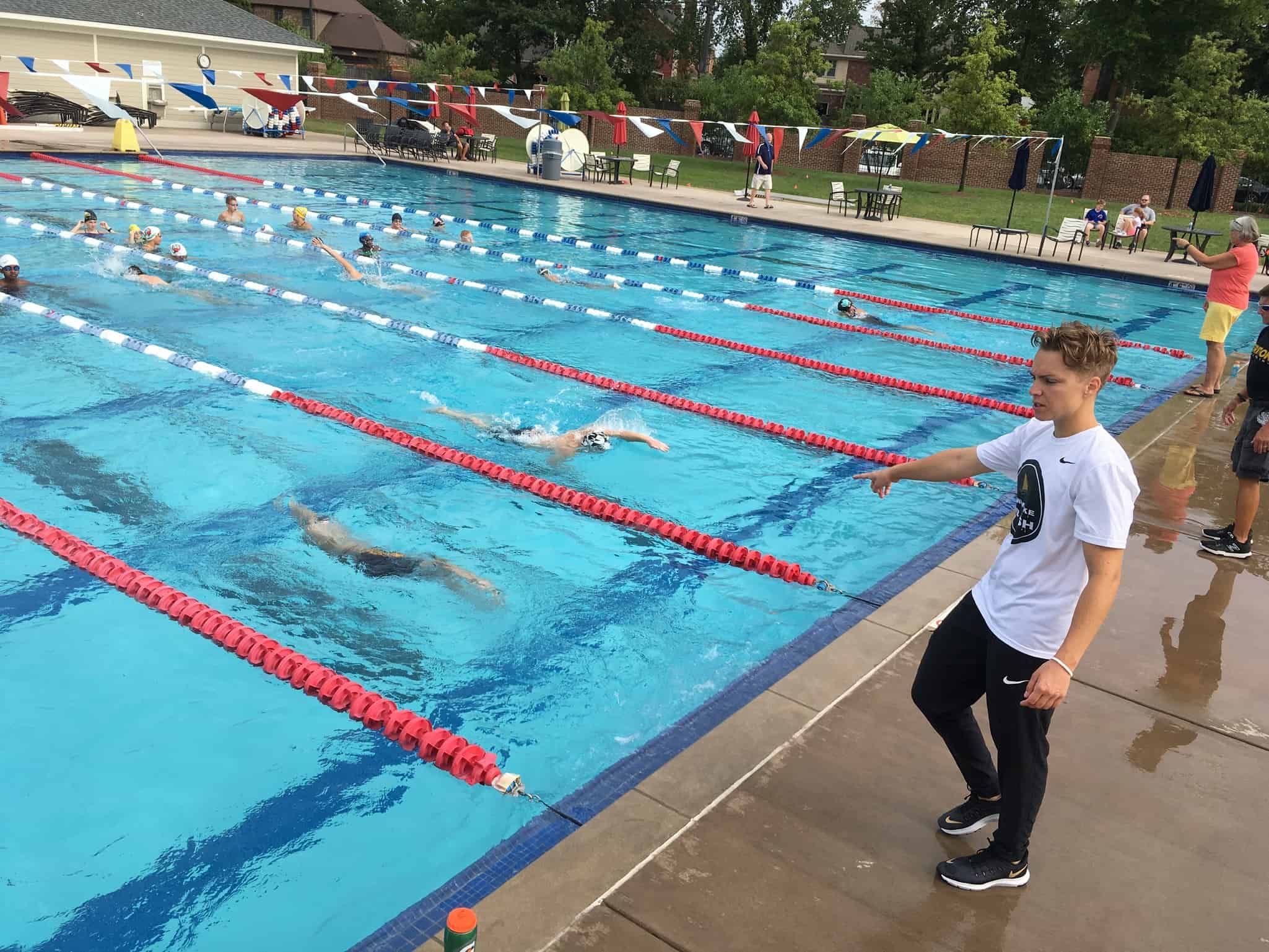 Abbie Fish providing in-person coaching during a swim camp.