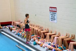 Abbie Fish during a swim camp training with young swimmers.