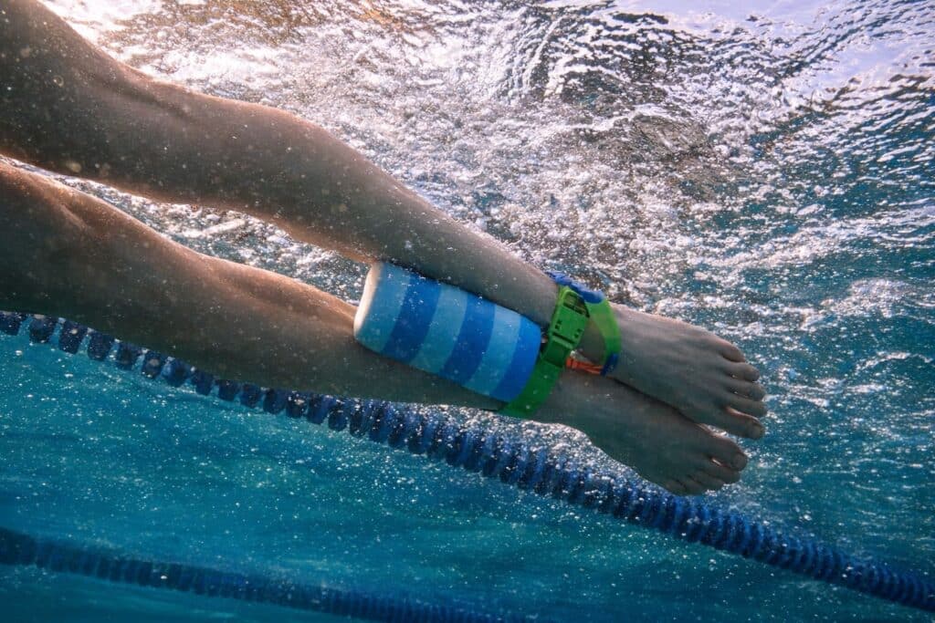 Image shows how to use Pull Buoy while swimming