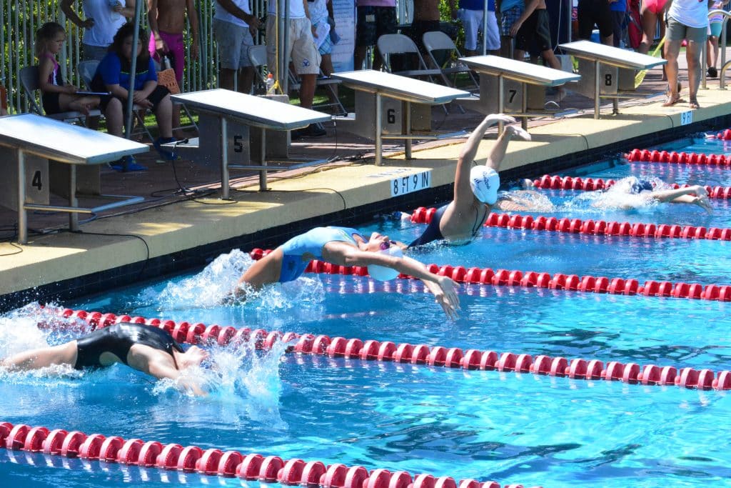 Swimming competitions for different age groups.