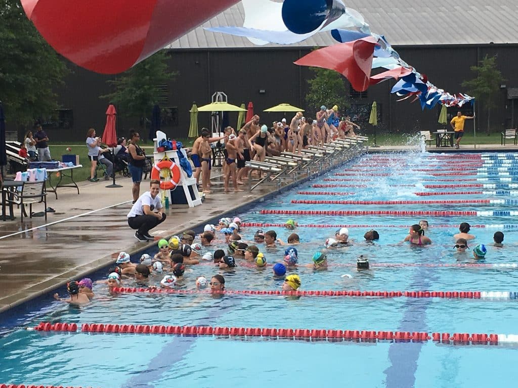 Coach Abbie during an age group swimming competition.