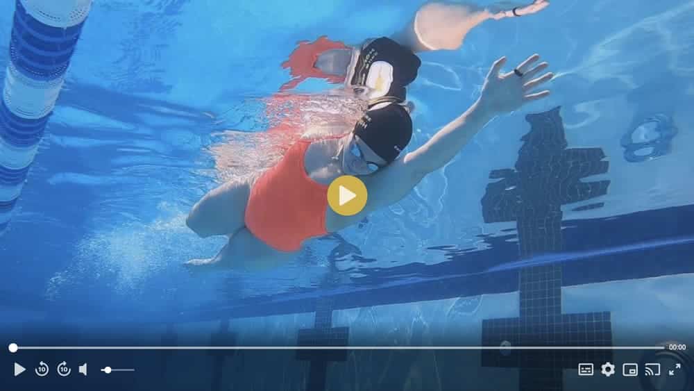Kick on Side: One Arm Up, One Arm Down Swimming Drill