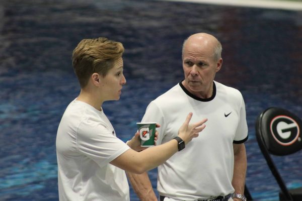 Abbie Fish talking to another swim coach.