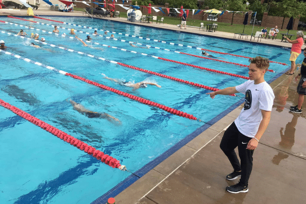 Abbie coaching swimmers during a 90-Day Training Plan.